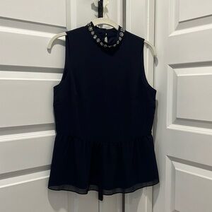J Crew navy silk sleeveless peplum top with beautiful jewels around neckline. Xs